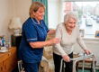 A carer in Oxford helping an elderly lady. The benefits of home care in Oxford, Leighton Buzzard and Kings Langley